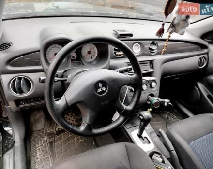 Чорний Міцубісі Аутлендер, об'ємом двигуна 2.38 л та пробігом 149 тис. км за 8800 $, фото 8 на Automoto.ua