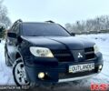 Черный Мицубиси Аутлендер, объемом двигателя 2.4 л и пробегом 150 тыс. км за 8100 $, фото 1 на Automoto.ua