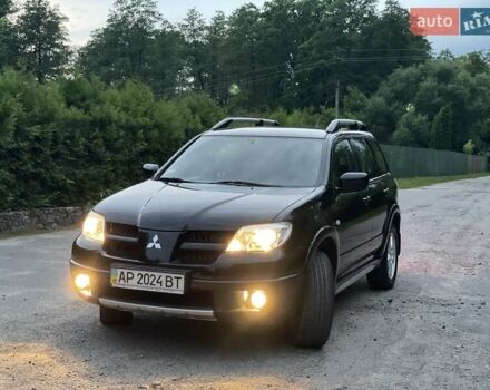 Чорний Міцубісі Аутлендер, об'ємом двигуна 2 л та пробігом 79 тис. км за 9500 $, фото 156 на Automoto.ua