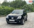 Чорний Міцубісі Аутлендер, об'ємом двигуна 2 л та пробігом 79 тис. км за 9500 $, фото 5 на Automoto.ua