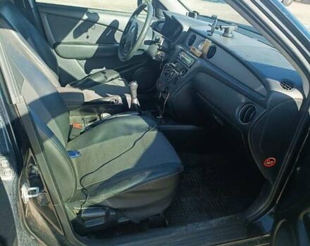 Черный Мицубиси Аутлендер, объемом двигателя 2 л и пробегом 235 тыс. км за 6900 $, фото 2 на Automoto.ua