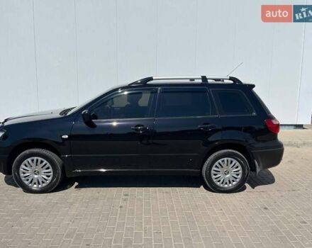 Черный Мицубиси Аутлендер, объемом двигателя 2 л и пробегом 236 тыс. км за 6699 $, фото 10 на Automoto.ua