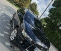 Черный Мицубиси Аутлендер, объемом двигателя 2.4 л и пробегом 233 тыс. км за 9800 $, фото 1 на Automoto.ua