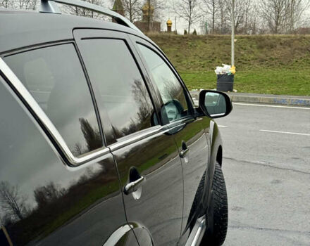 Чорний Міцубісі Аутлендер, об'ємом двигуна 2 л та пробігом 228 тис. км за 10550 $, фото 11 на Automoto.ua