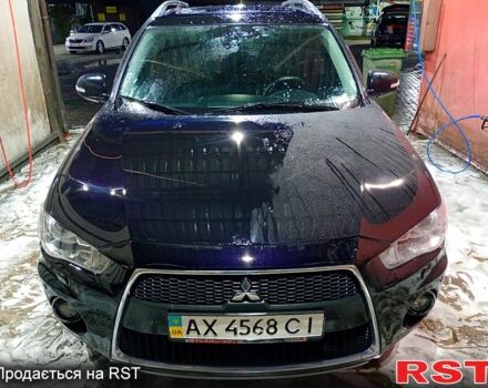 Черный Мицубиси Аутлендер, объемом двигателя 2.4 л и пробегом 70 тыс. км за 10500 $, фото 1 на Automoto.ua