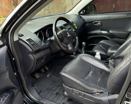 Чорний Міцубісі Аутлендер, об'ємом двигуна 2 л та пробігом 258 тис. км за 8699 $, фото 11 на Automoto.ua