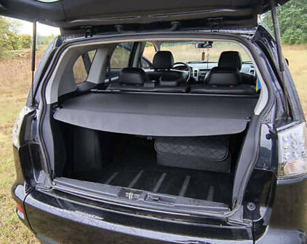 Черный Мицубиси Аутлендер, объемом двигателя 2.27 л и пробегом 238 тыс. км за 11500 $, фото 5 на Automoto.ua