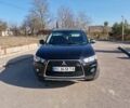 Черный Мицубиси Аутлендер, объемом двигателя 2 л и пробегом 209 тыс. км за 9999 $, фото 1 на Automoto.ua