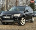 Черный Мицубиси Аутлендер, объемом двигателя 2.18 л и пробегом 249 тыс. км за 11500 $, фото 1 на Automoto.ua