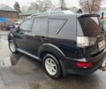 Черный Мицубиси Аутлендер, объемом двигателя 2.4 л и пробегом 305 тыс. км за 10000 $, фото 1 на Automoto.ua