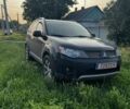 Черный Мицубиси Аутлендер, объемом двигателя 2.4 л и пробегом 200 тыс. км за 4800 $, фото 1 на Automoto.ua