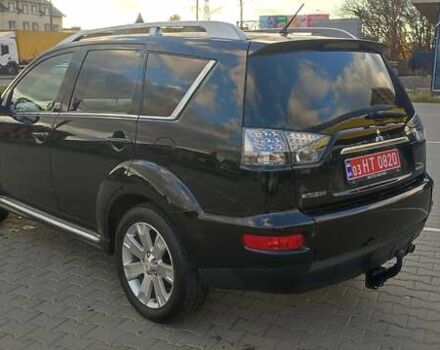 Черный Мицубиси Аутлендер, объемом двигателя 2 л и пробегом 210 тыс. км за 10600 $, фото 4 на Automoto.ua