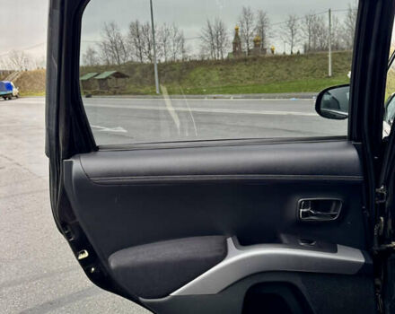 Чорний Міцубісі Аутлендер, об'ємом двигуна 2 л та пробігом 228 тис. км за 10550 $, фото 30 на Automoto.ua