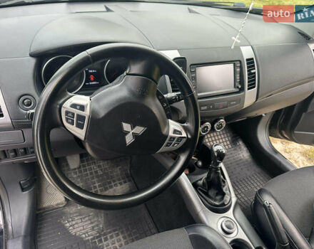 Черный Мицубиси Аутлендер, объемом двигателя 1.97 л и пробегом 224 тыс. км за 9000 $, фото 1 на Automoto.ua