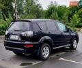 Чорний Міцубісі Аутлендер, об'ємом двигуна 2 л та пробігом 220 тис. км за 9900 $, фото 3 на Automoto.ua