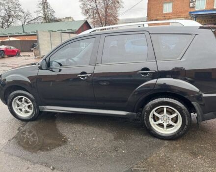 Черный Мицубиси Аутлендер, объемом двигателя 2.4 л и пробегом 305 тыс. км за 10000 $, фото 1 на Automoto.ua