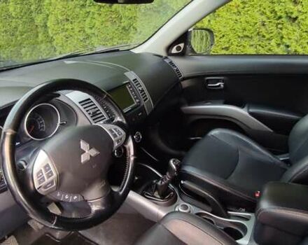 Черный Мицубиси Аутлендер, объемом двигателя 2 л и пробегом 210 тыс. км за 10600 $, фото 9 на Automoto.ua