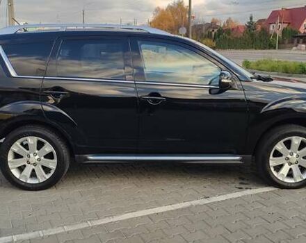 Черный Мицубиси Аутлендер, объемом двигателя 2 л и пробегом 210 тыс. км за 10600 $, фото 8 на Automoto.ua