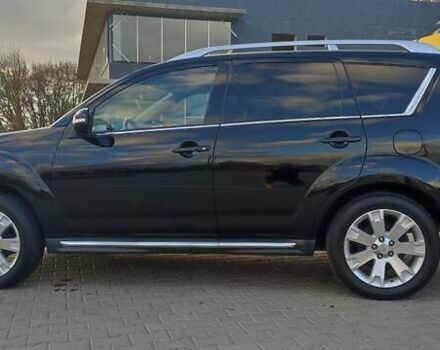 Черный Мицубиси Аутлендер, объемом двигателя 2 л и пробегом 210 тыс. км за 10600 $, фото 3 на Automoto.ua