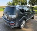 Черный Мицубиси Аутлендер, объемом двигателя 2 л и пробегом 280 тыс. км за 4330 $, фото 2 на Automoto.ua