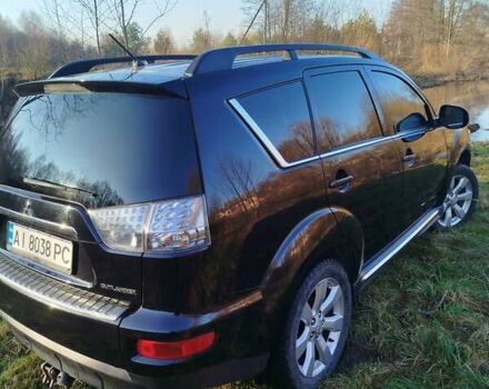 Черный Мицубиси Аутлендер, объемом двигателя 2 л и пробегом 261 тыс. км за 9700 $, фото 1 на Automoto.ua