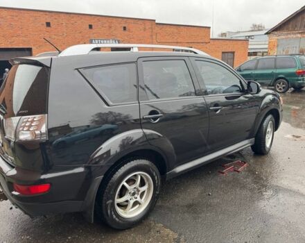 Черный Мицубиси Аутлендер, объемом двигателя 2.4 л и пробегом 305 тыс. км за 10000 $, фото 3 на Automoto.ua