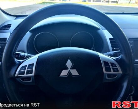 Черный Мицубиси Аутлендер, объемом двигателя 2 л и пробегом 224 тыс. км за 12300 $, фото 4 на Automoto.ua