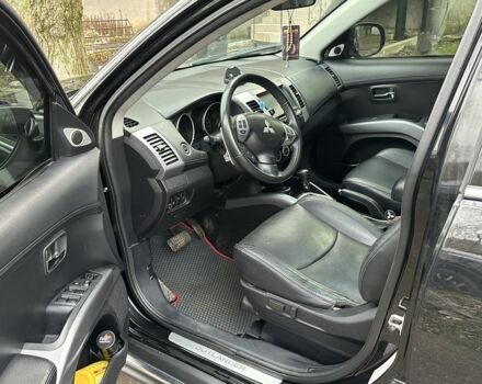 Черный Мицубиси Аутлендер, объемом двигателя 2.4 л и пробегом 197 тыс. км за 11300 $, фото 6 на Automoto.ua