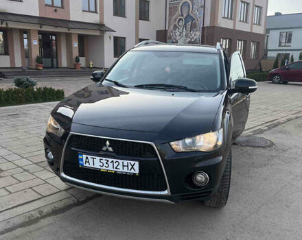 Черный Мицубиси Аутлендер, объемом двигателя 2.36 л и пробегом 244 тыс. км за 9850 $, фото 1 на Automoto.ua