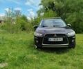 Черный Мицубиси Аутлендер, объемом двигателя 2 л и пробегом 255 тыс. км за 9200 $, фото 1 на Automoto.ua