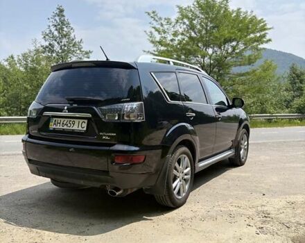 Черный Мицубиси Аутлендер, объемом двигателя 2.4 л и пробегом 275 тыс. км за 12000 $, фото 3 на Automoto.ua