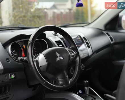 Черный Мицубиси Аутлендер, объемом двигателя 2.4 л и пробегом 184 тыс. км за 10800 $, фото 5 на Automoto.ua