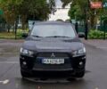 Чорний Міцубісі Аутлендер, об'ємом двигуна 2 л та пробігом 220 тис. км за 9900 $, фото 1 на Automoto.ua
