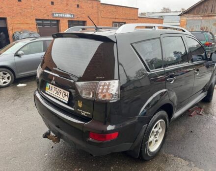 Черный Мицубиси Аутлендер, объемом двигателя 2.4 л и пробегом 305 тыс. км за 10000 $, фото 2 на Automoto.ua