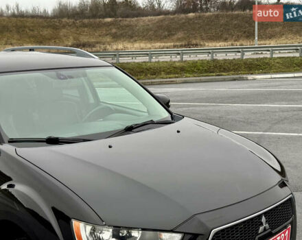 Чорний Міцубісі Аутлендер, об'ємом двигуна 2 л та пробігом 228 тис. км за 10550 $, фото 7 на Automoto.ua