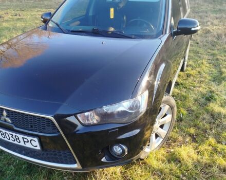 Черный Мицубиси Аутлендер, объемом двигателя 2 л и пробегом 261 тыс. км за 9700 $, фото 1 на Automoto.ua