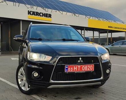 Черный Мицубиси Аутлендер, объемом двигателя 2 л и пробегом 210 тыс. км за 10600 $, фото 1 на Automoto.ua