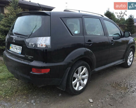 Черный Мицубиси Аутлендер, объемом двигателя 2.36 л и пробегом 315 тыс. км за 9700 $, фото 3 на Automoto.ua