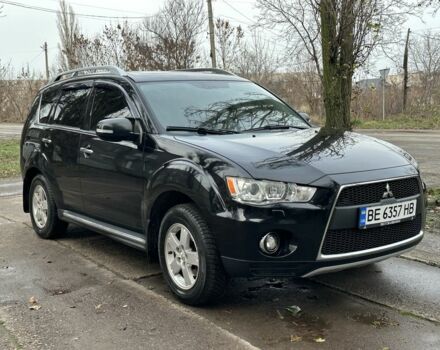 Черный Мицубиси Аутлендер, объемом двигателя 2.4 л и пробегом 197 тыс. км за 11300 $, фото 1 на Automoto.ua