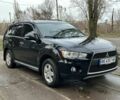 Черный Мицубиси Аутлендер, объемом двигателя 2.4 л и пробегом 197 тыс. км за 11300 $, фото 1 на Automoto.ua