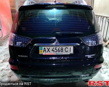 Черный Мицубиси Аутлендер, объемом двигателя 2.4 л и пробегом 70 тыс. км за 10500 $, фото 4 на Automoto.ua