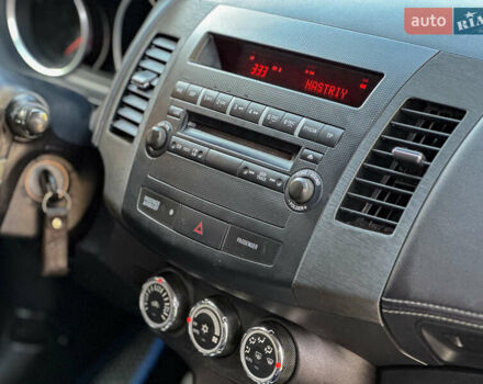 Черный Мицубиси Аутлендер, объемом двигателя 2.2 л и пробегом 226 тыс. км за 11500 $, фото 102 на Automoto.ua