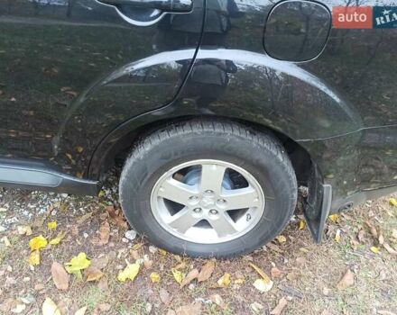 Черный Мицубиси Аутлендер, объемом двигателя 3 л и пробегом 240 тыс. км за 9500 $, фото 4 на Automoto.ua