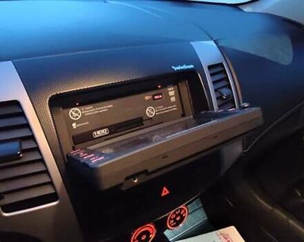 Черный Мицубиси Аутлендер, объемом двигателя 2 л и пробегом 210 тыс. км за 10600 $, фото 40 на Automoto.ua