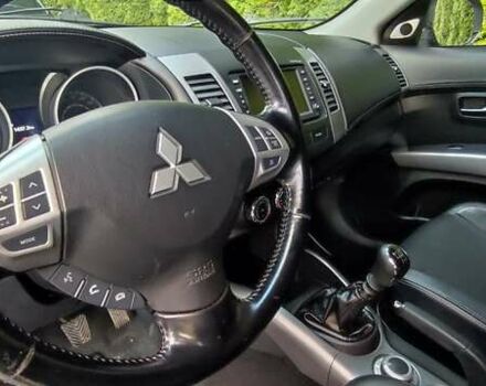 Черный Мицубиси Аутлендер, объемом двигателя 2 л и пробегом 210 тыс. км за 10600 $, фото 11 на Automoto.ua