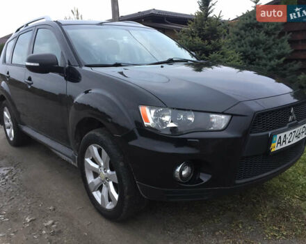 Черный Мицубиси Аутлендер, объемом двигателя 2.36 л и пробегом 315 тыс. км за 9700 $, фото 1 на Automoto.ua