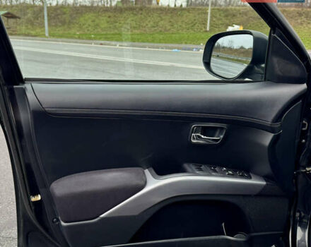 Чорний Міцубісі Аутлендер, об'ємом двигуна 2 л та пробігом 228 тис. км за 10550 $, фото 26 на Automoto.ua