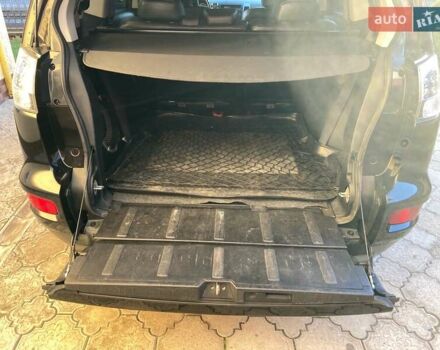 Черный Мицубиси Аутлендер, объемом двигателя 1.97 л и пробегом 292 тыс. км за 10900 $, фото 1 на Automoto.ua