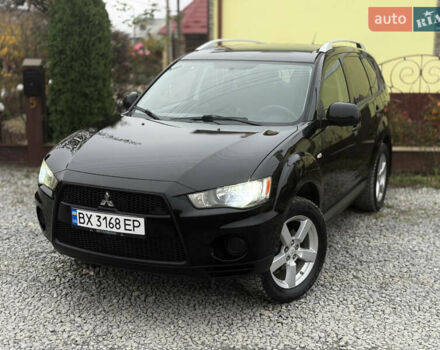 Черный Мицубиси Аутлендер, объемом двигателя 2.4 л и пробегом 184 тыс. км за 10800 $, фото 1 на Automoto.ua