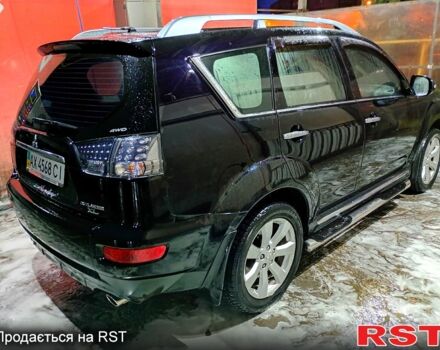 Черный Мицубиси Аутлендер, объемом двигателя 2.4 л и пробегом 70 тыс. км за 10500 $, фото 3 на Automoto.ua